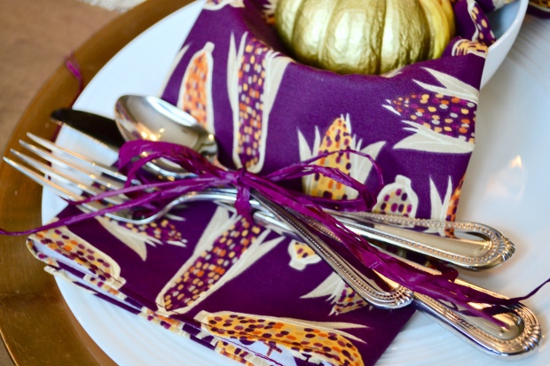 {Fun, Yum & Frills} Silverware tied with a purple raffia to match this colorful Friendsgiving/Thanksgiving tablescape on funyumandfrills.com