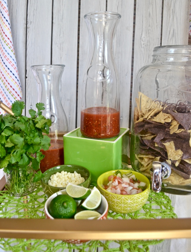 {Fun, Yum & Frills} A unique spin on a Cinco de Mayo bar cart by subbing out the alcohol and bar items to create a fun chips and salsa cart! #mexicanfood #cincodemayoparty